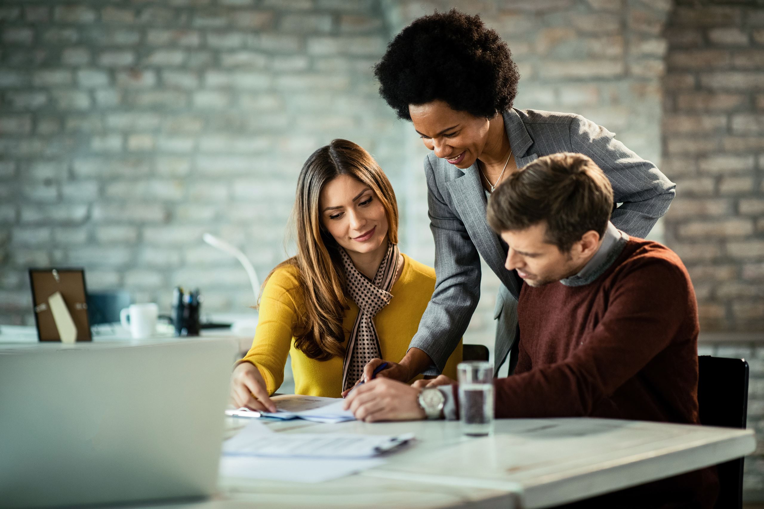 Couple consulting with a woman